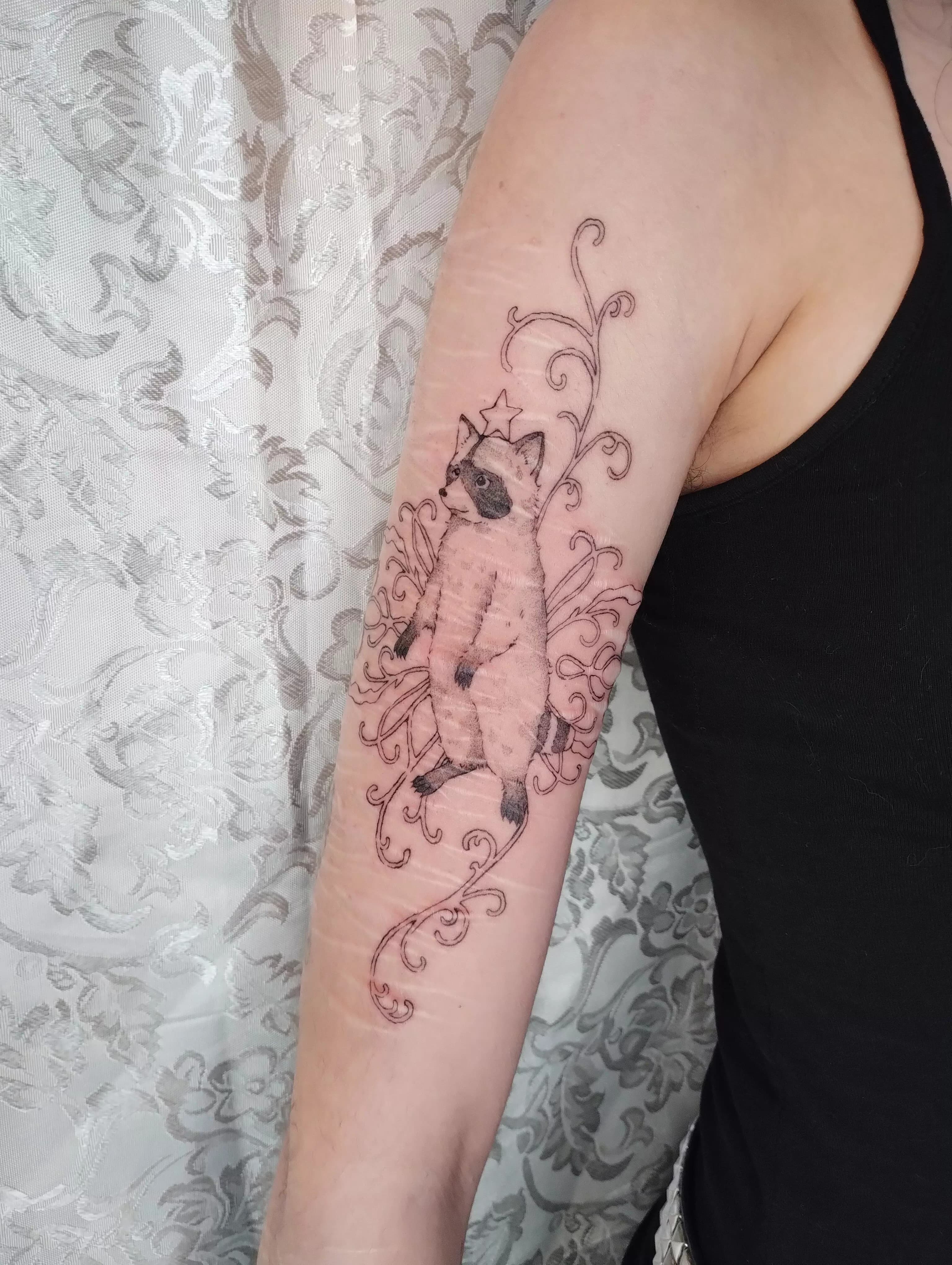racoon ornamental arm cuff
